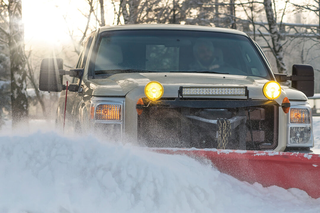 Image of a snowplow plowing the roads.