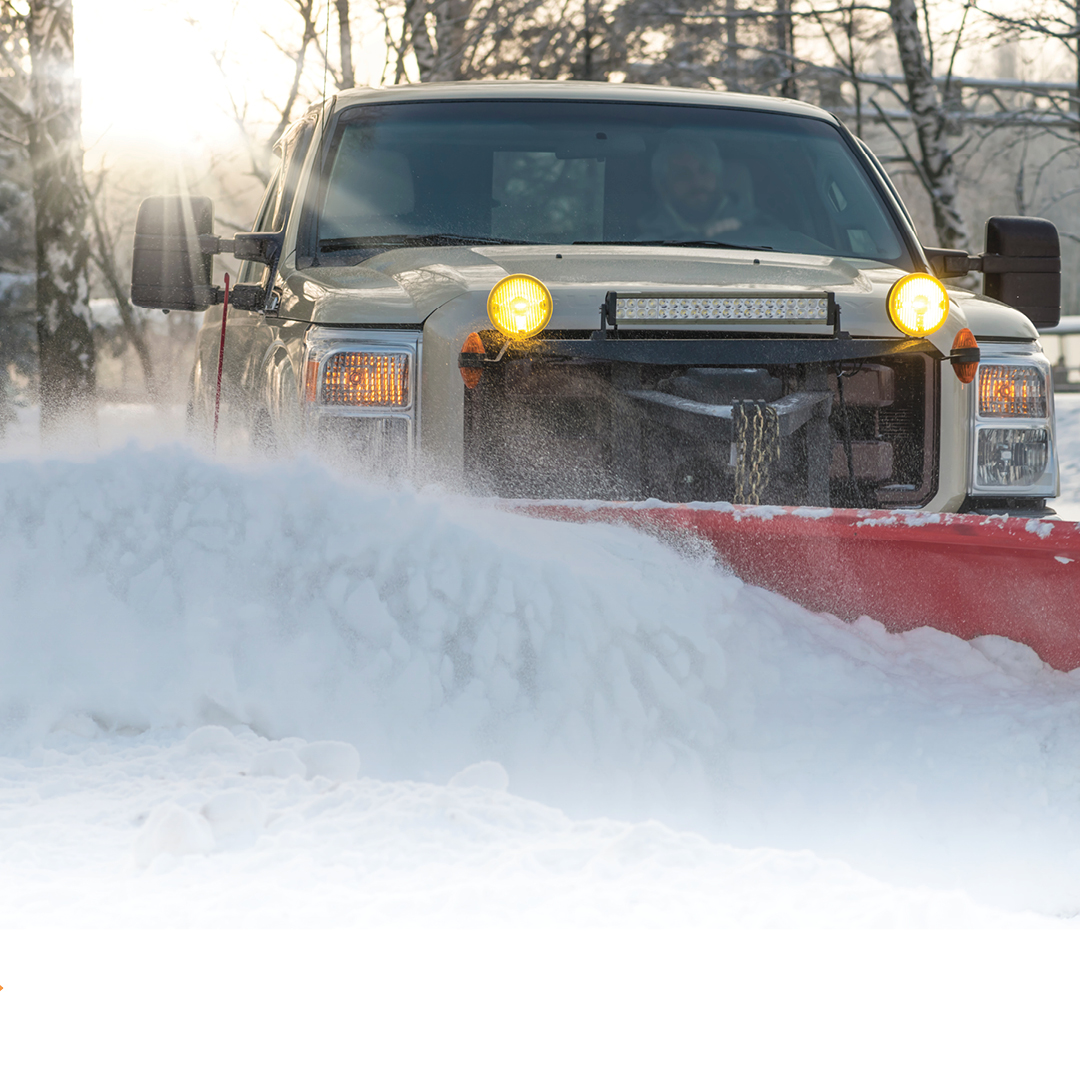 Image of a snowplow plowing the roads.